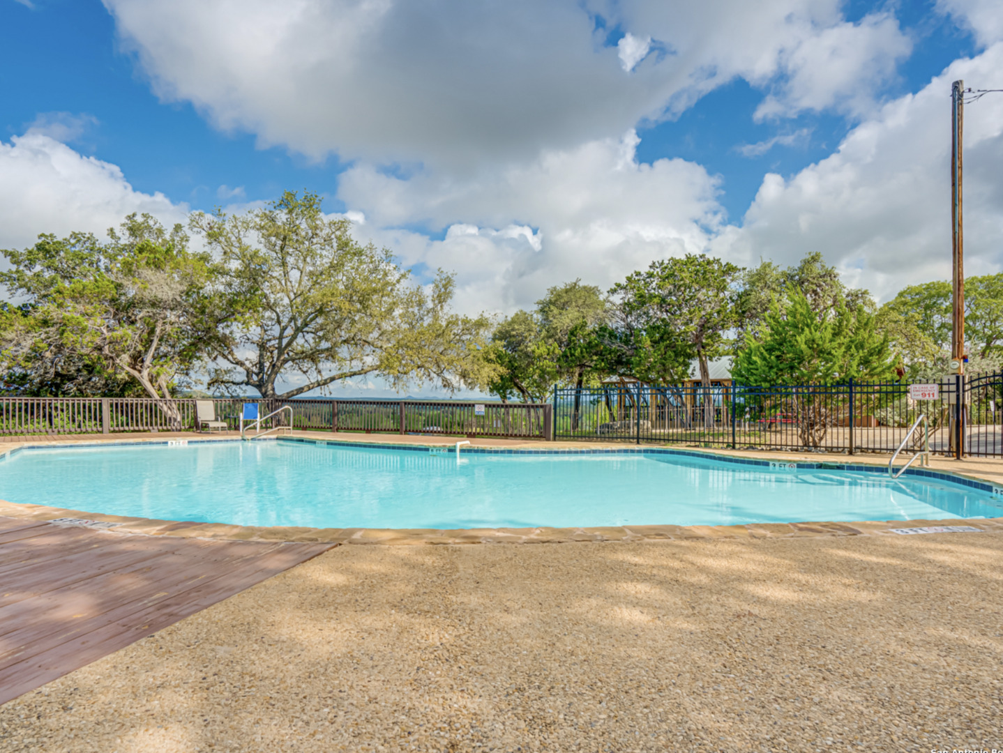 259 Forest Ridge Drive Lakehills, TX 78063 - Photo 23 of 30 a view of a golf course with a lake