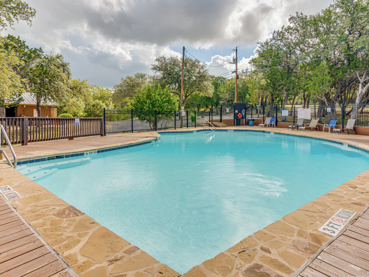259 Forest Ridge Drive Lakehills, TX 78063 - Photo 24 of 30 a view of swimming pool with a yard