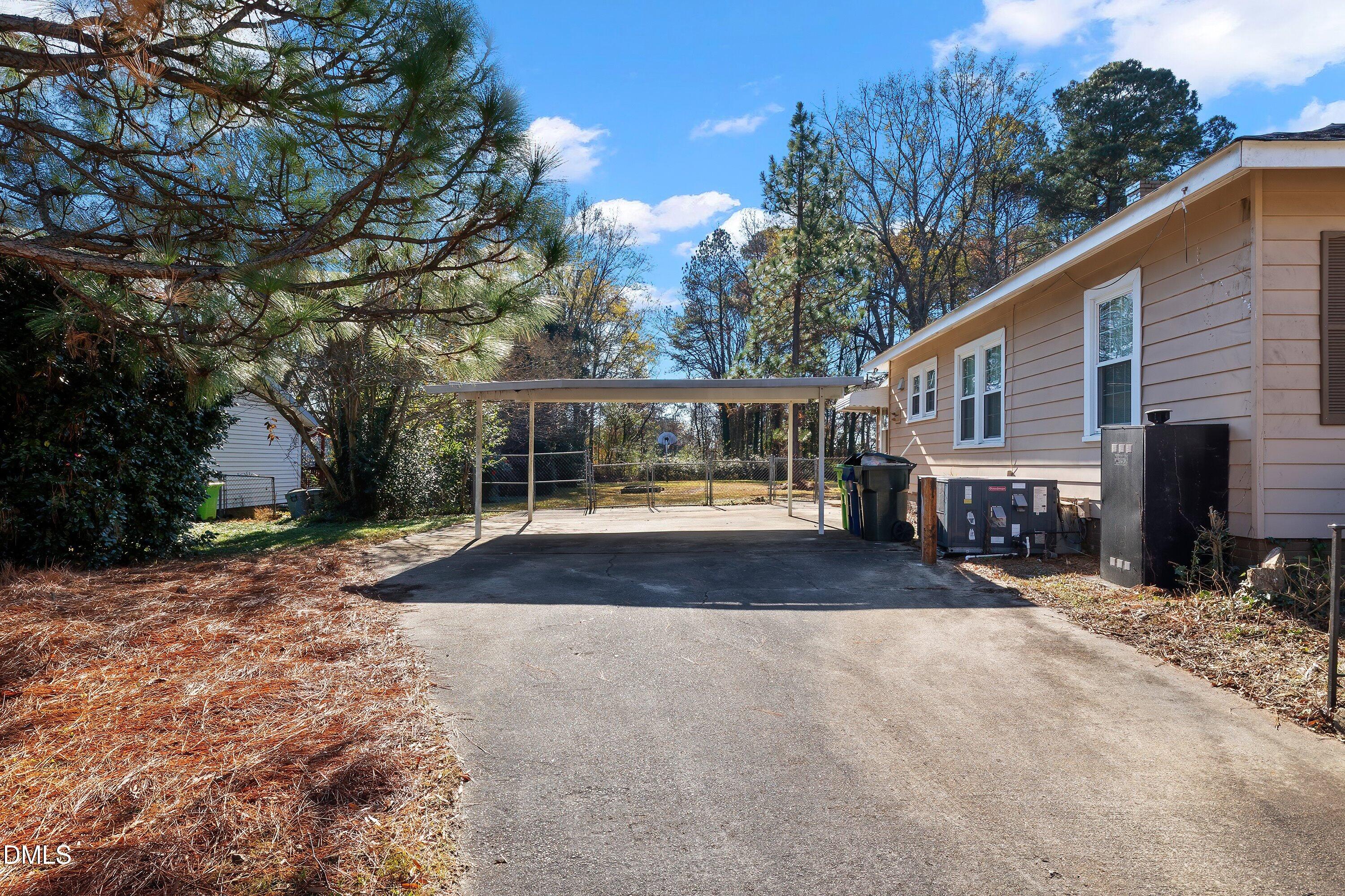 3010 Burrell Place Raleigh, NC 27607 - Photo 13 of 46 a view of a house with a yard and garage