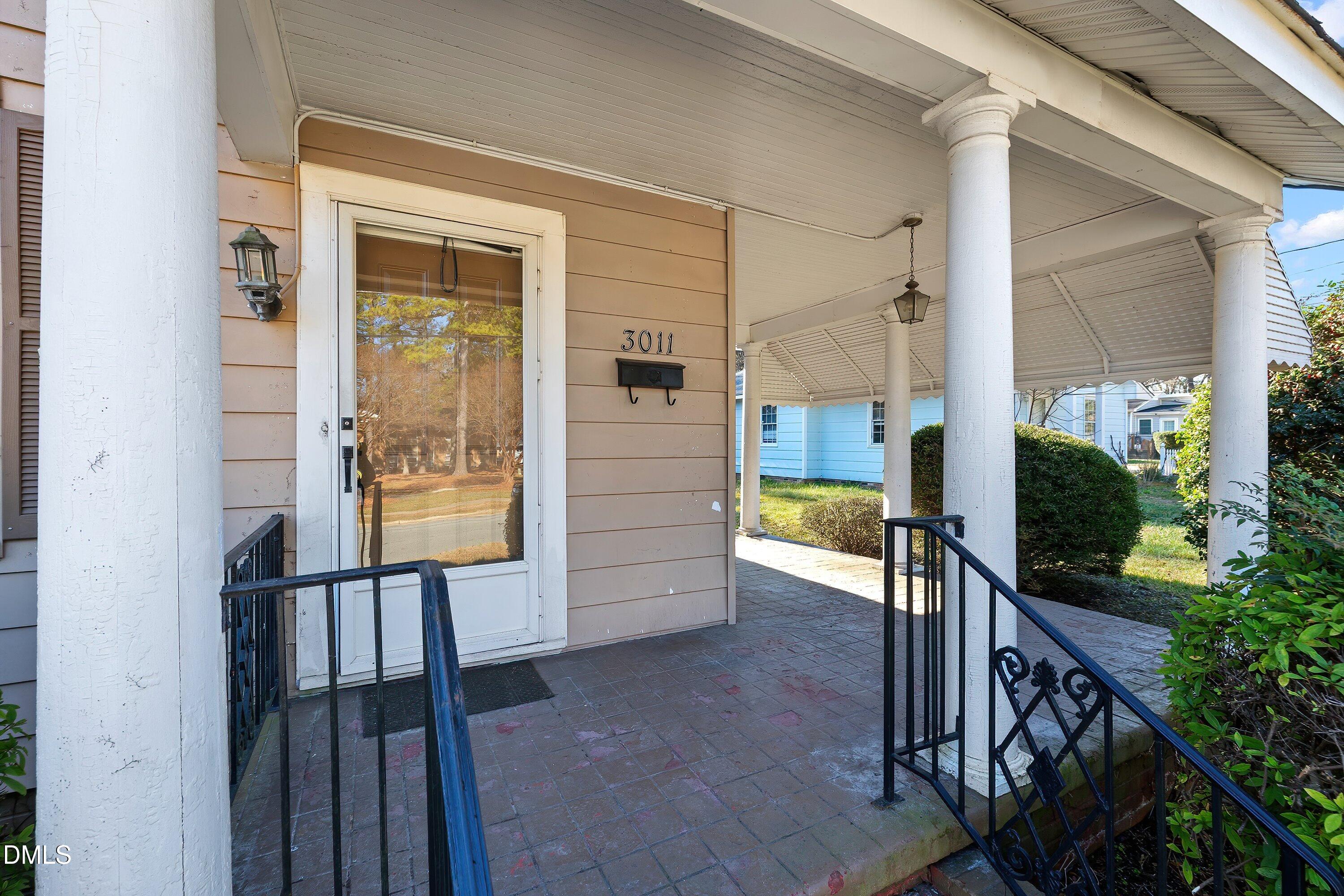 3010 Burrell Place Raleigh, NC 27607 - Photo 14 of 46 a view of entryway and hall with wooden floor