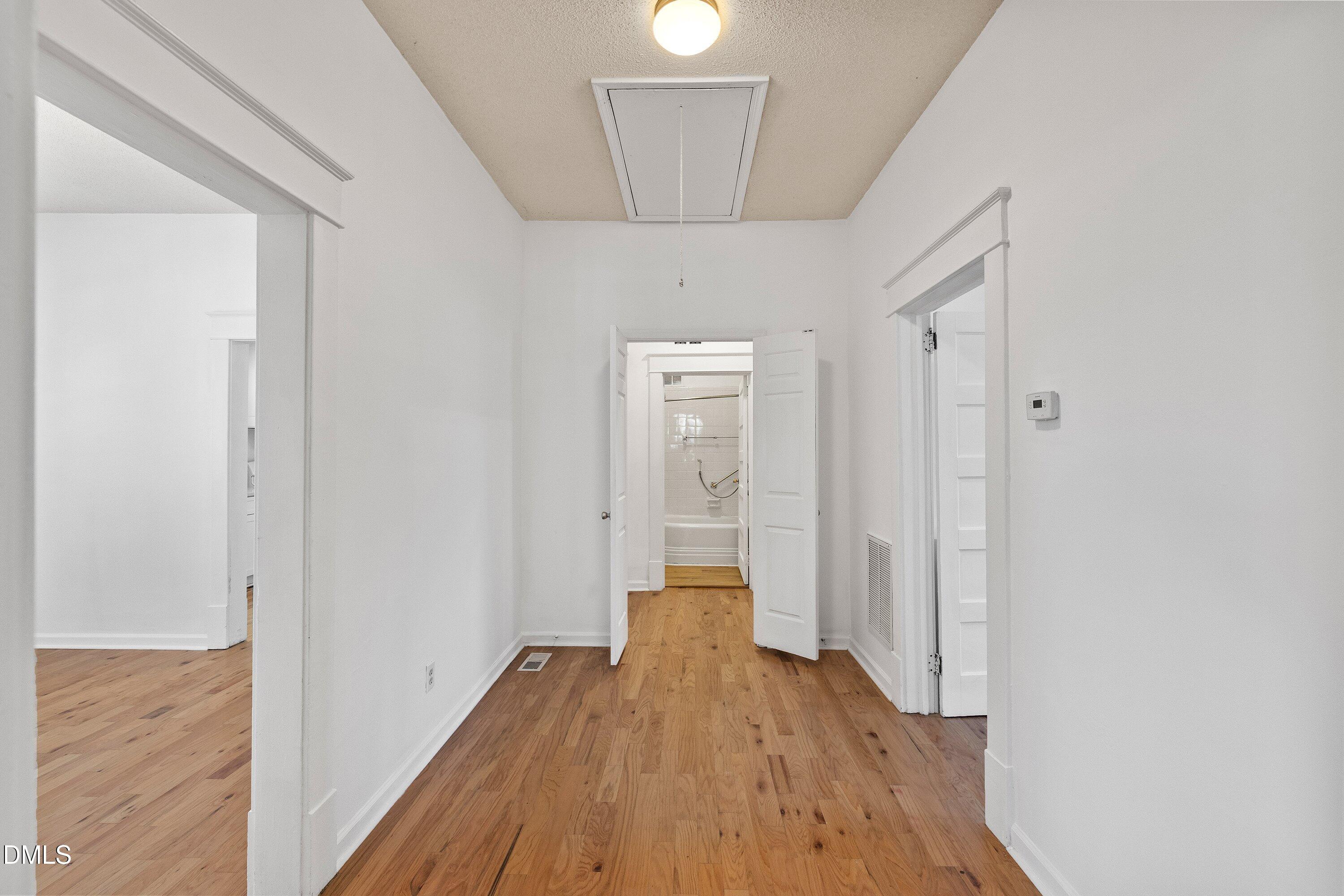 3010 Burrell Place Raleigh, NC 27607 - Photo 22 of 46 a view of a hallway with wooden floor