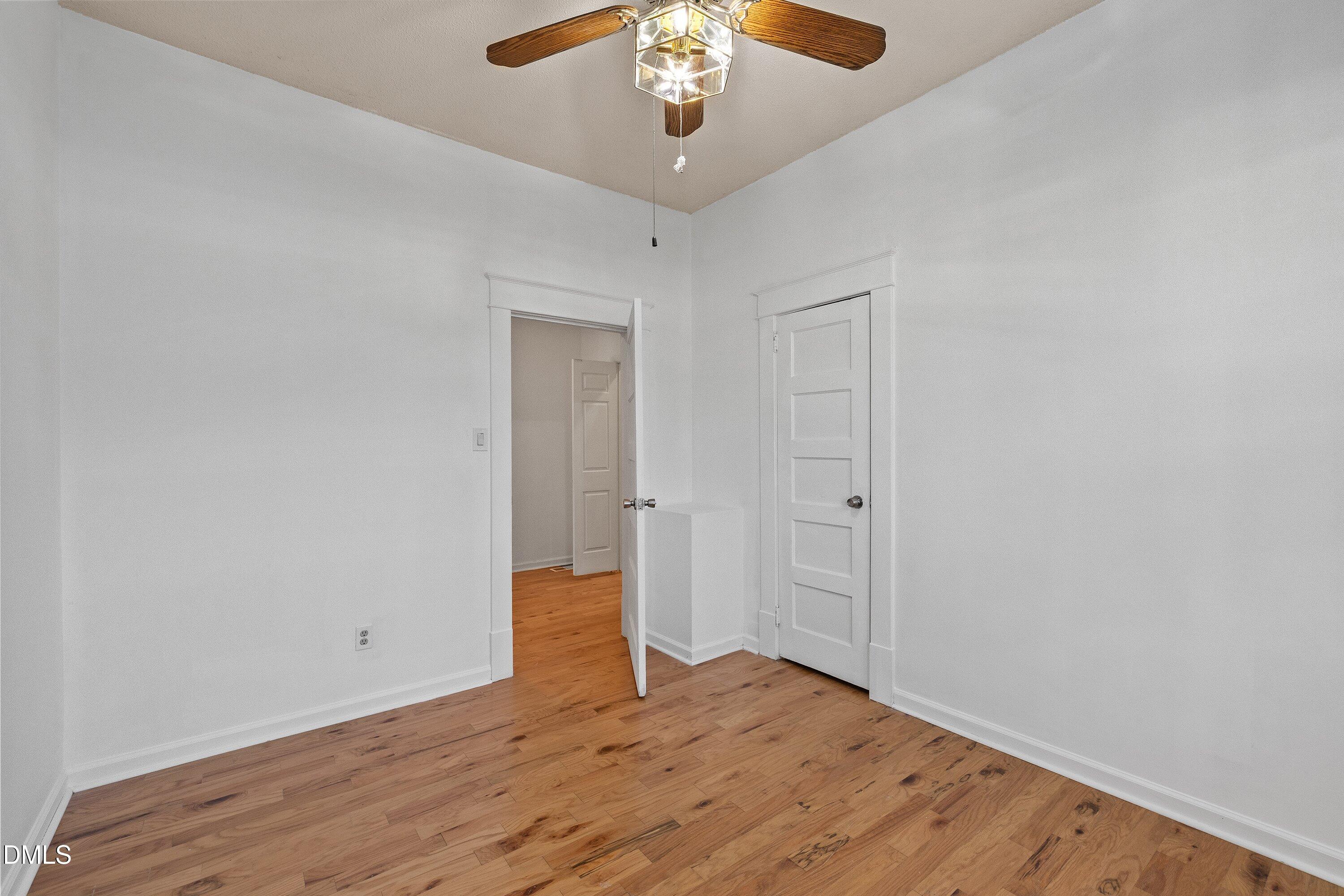 3010 Burrell Place Raleigh, NC 27607 - Photo 24 of 46 a view of a room with wooden floor and chandelier