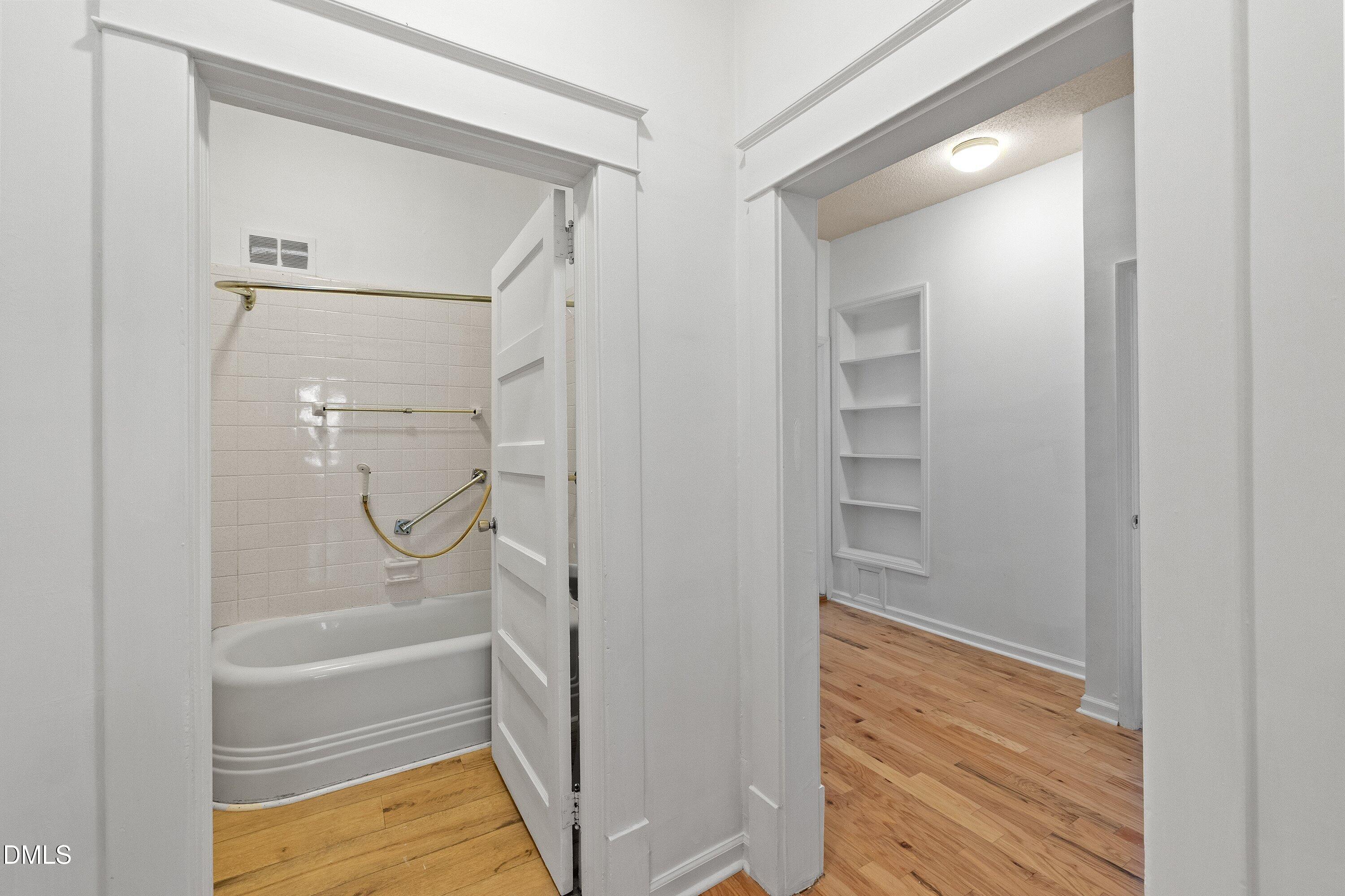 3010 Burrell Place Raleigh, NC 27607 - Photo 25 of 46 a bathroom with a glass shower door