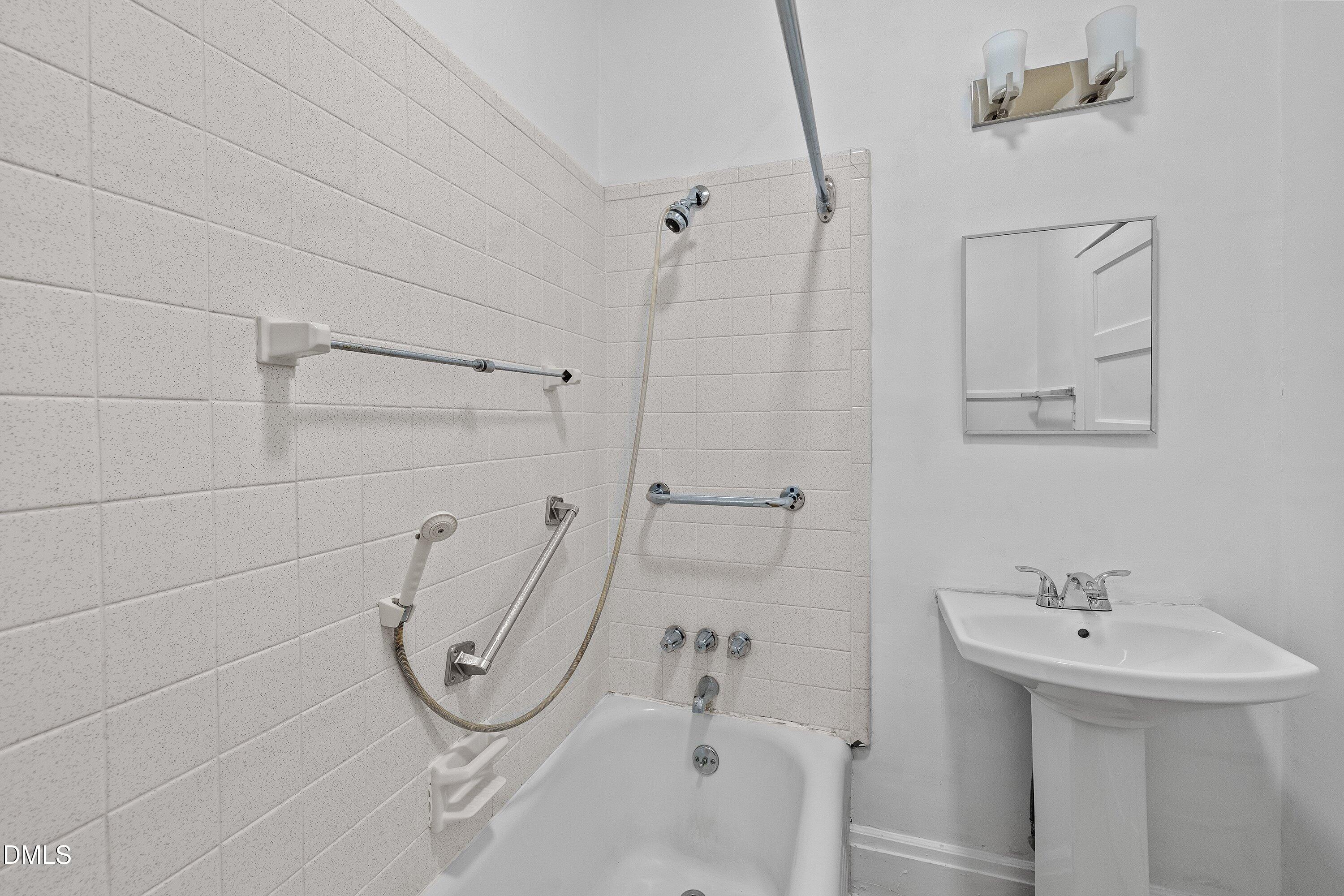 3010 Burrell Place Raleigh, NC 27607 - Photo 26 of 46 a bathroom with a sink a toilet and shower