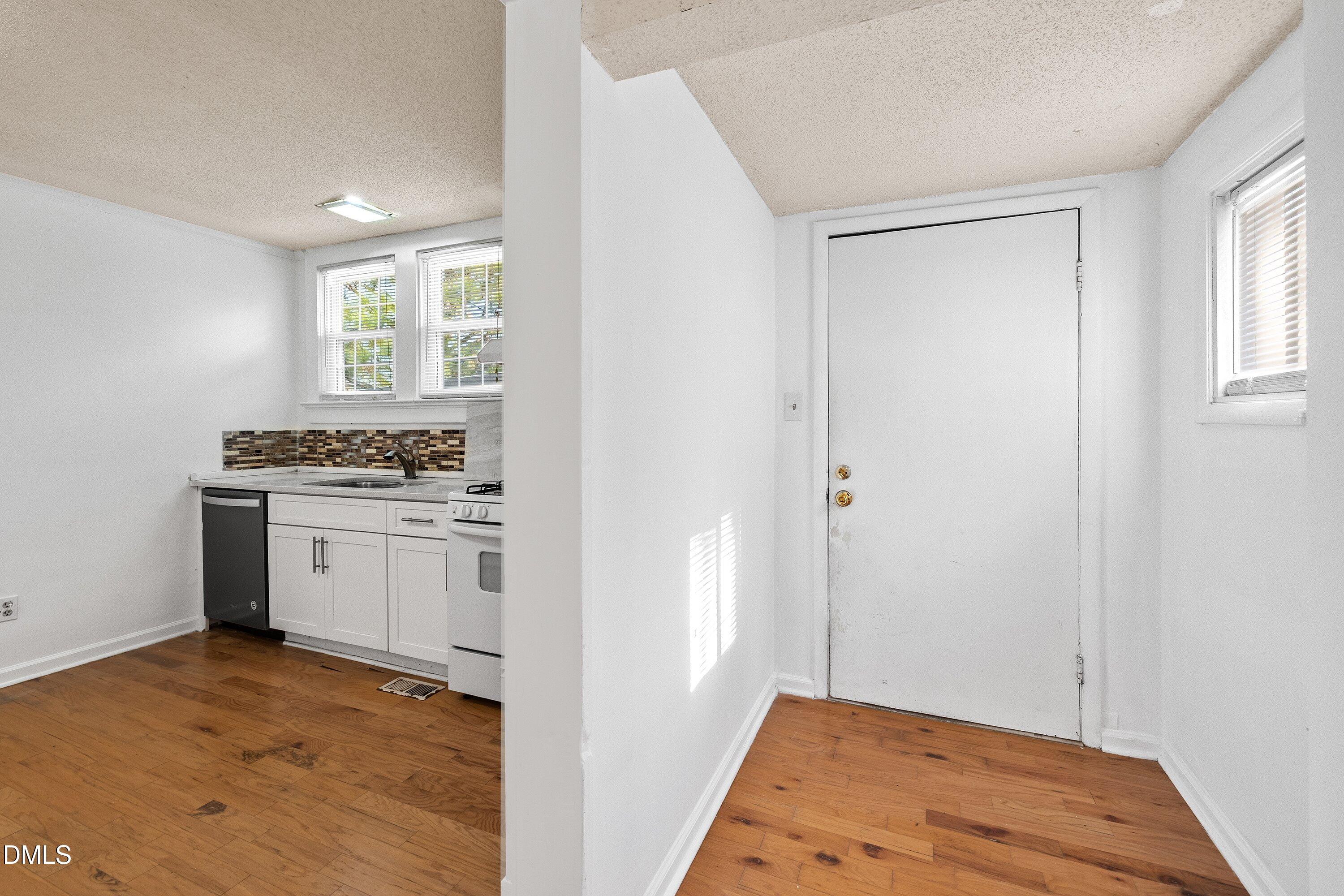 3010 Burrell Place Raleigh, NC 27607 - Photo 40 of 46 a kitchen with a refrigerator and window