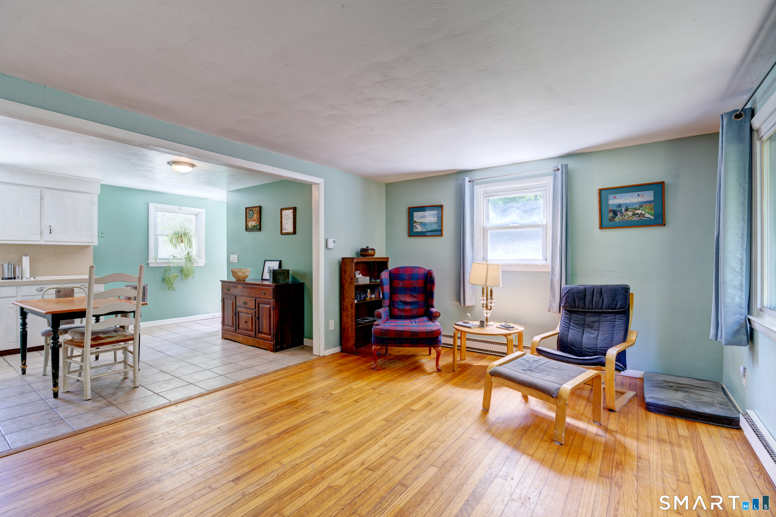 6 Chesbro Bridge Road Lebanon, CT 06249 - Photo 2 of 27 Living room open to kitchen.