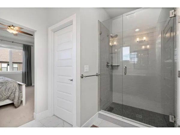a bathroom with a double vanity sink and mirror