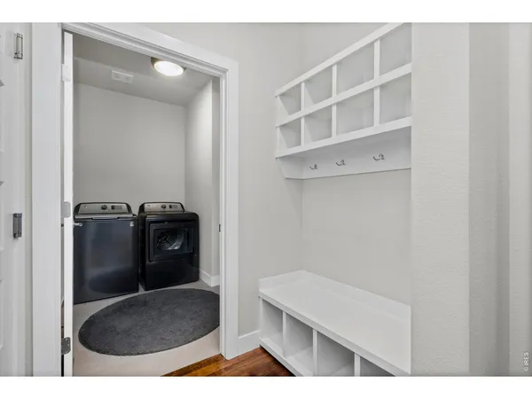 a view of storage and utility room with washer and dryer
