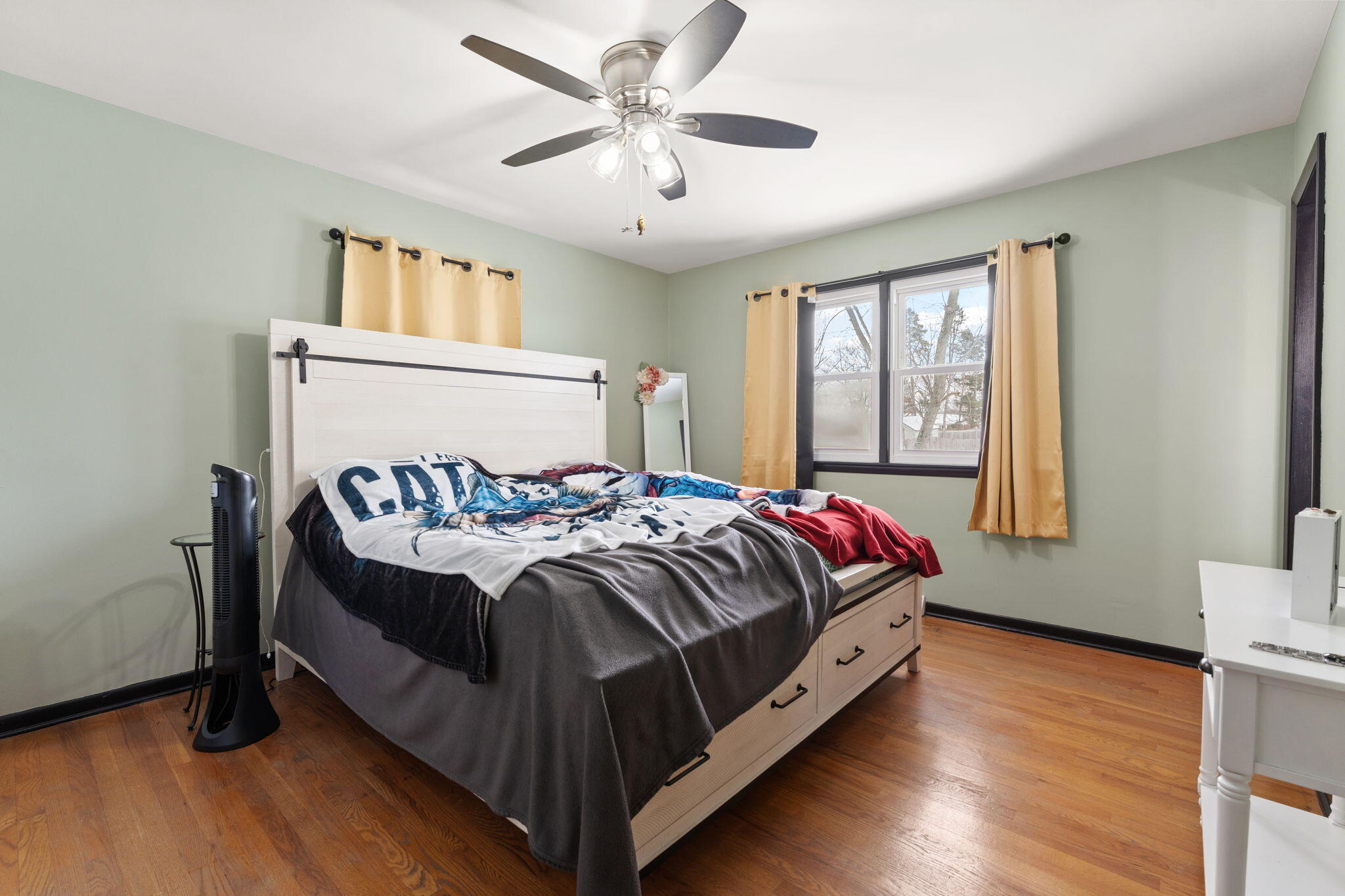 5345 Johnson Street Merrillville, IN 46410 - Photo 15 of 26 a bedroom with a bed and a window