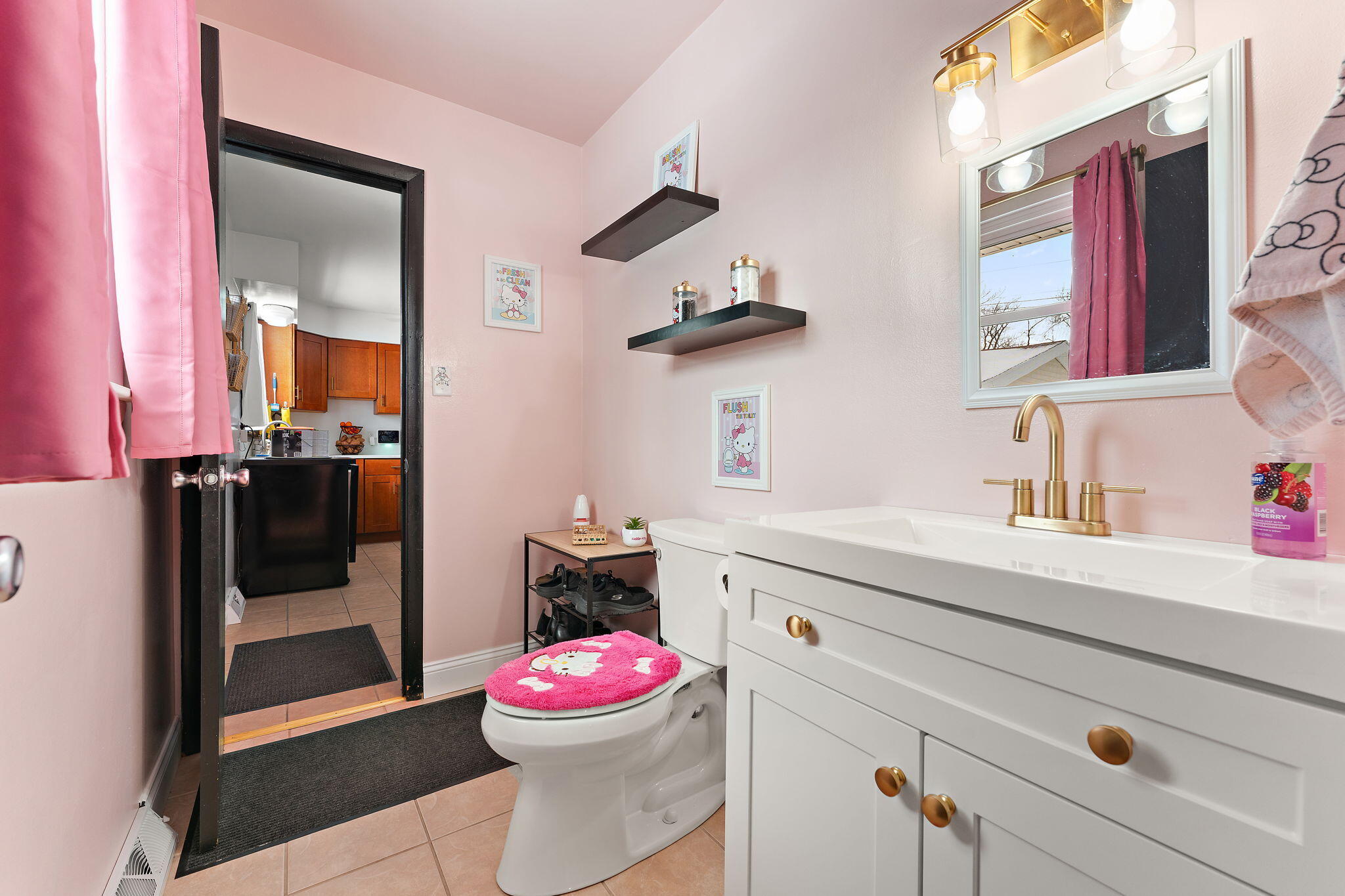 5345 Johnson Street Merrillville, IN 46410 - Photo 18 of 26 a bathroom with a sink and mirror with toilet