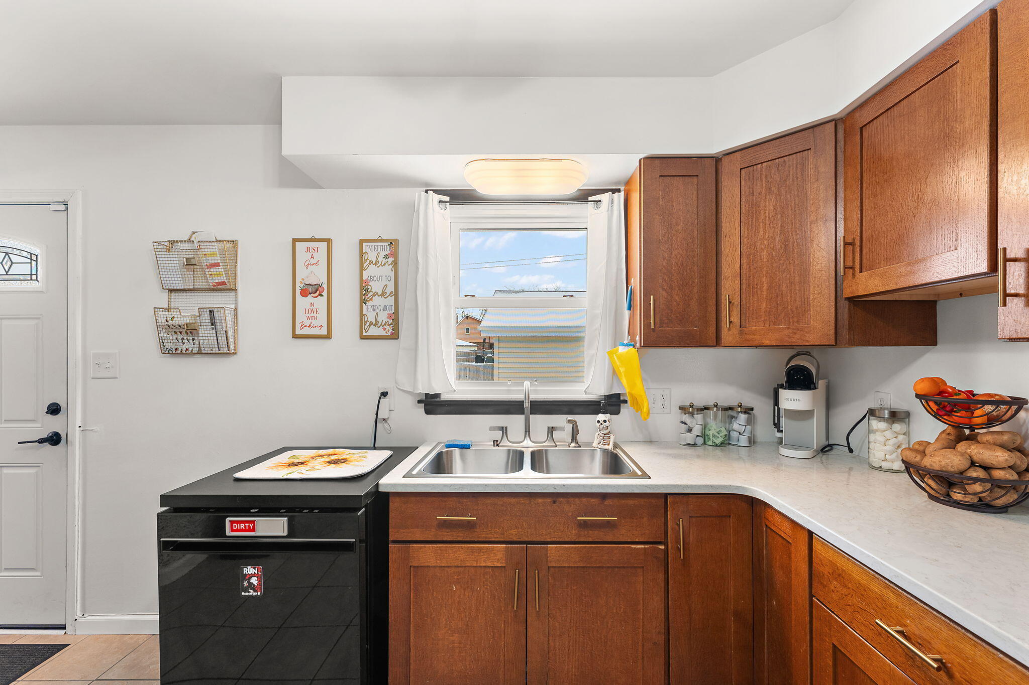 5345 Johnson Street Merrillville, IN 46410 - Photo 9 of 26 a kitchen with a sink cabinets and window