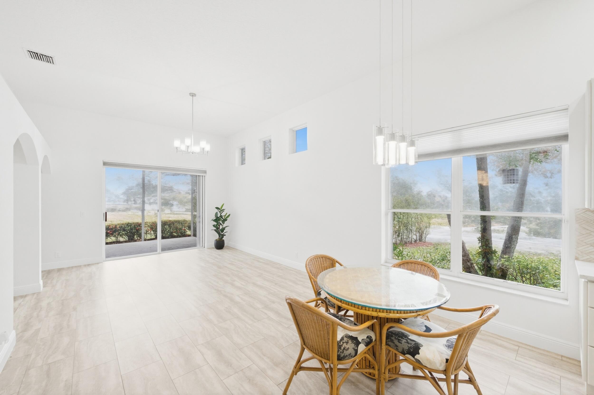 8534 Vía D Oro Boca Raton, FL 33433 - Photo 17 of 34 a view of a room with a table and chairs