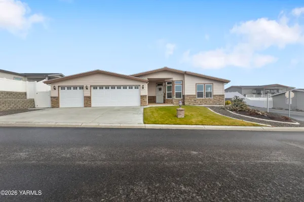 a view of a house with a swimming pool and a yard