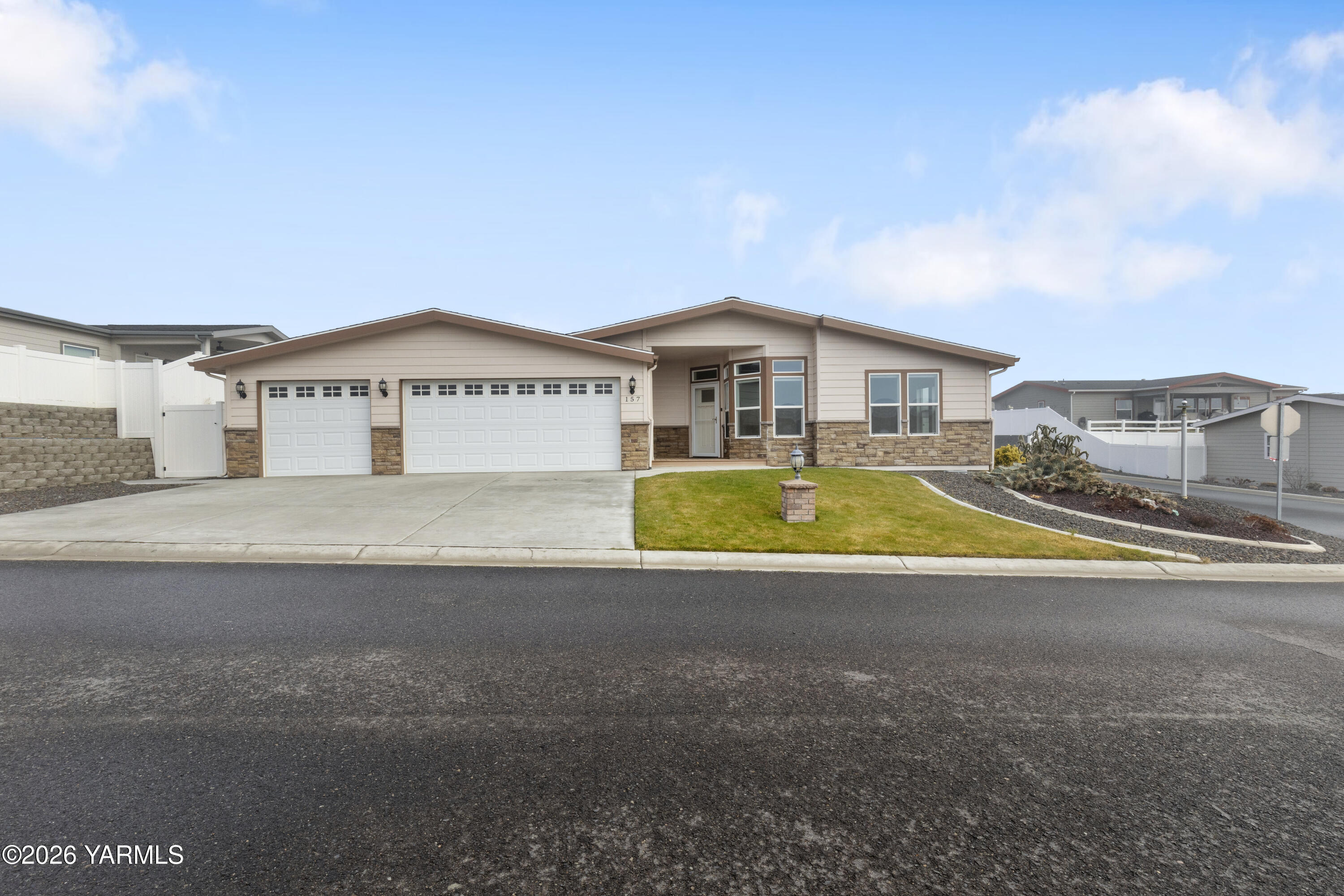 a view of a house with a swimming pool and a yard