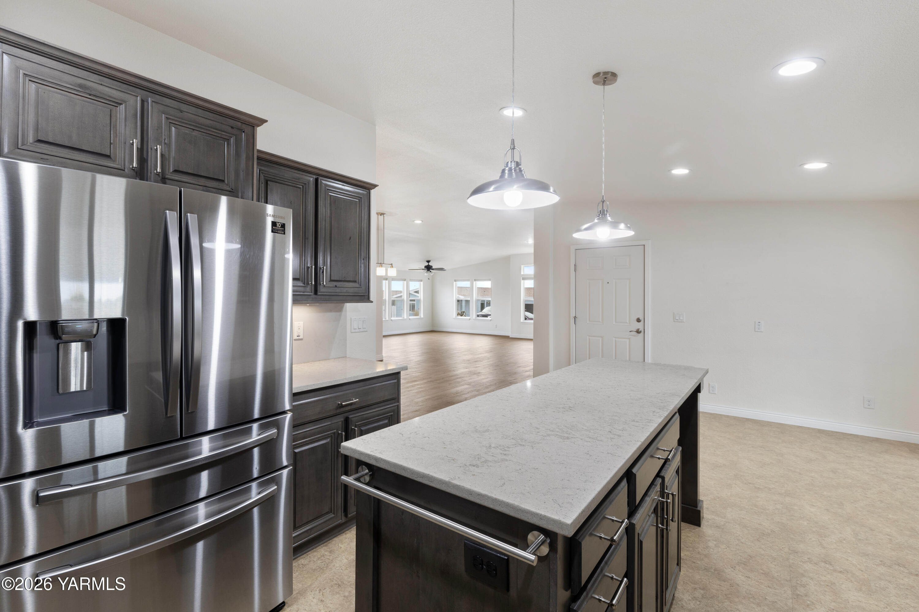 200 Bridle Way, Unit 157 Yakima, WA 98901 - Photo 11 of 30 a kitchen with kitchen island a refrigerator stove a sink and a refrigerator