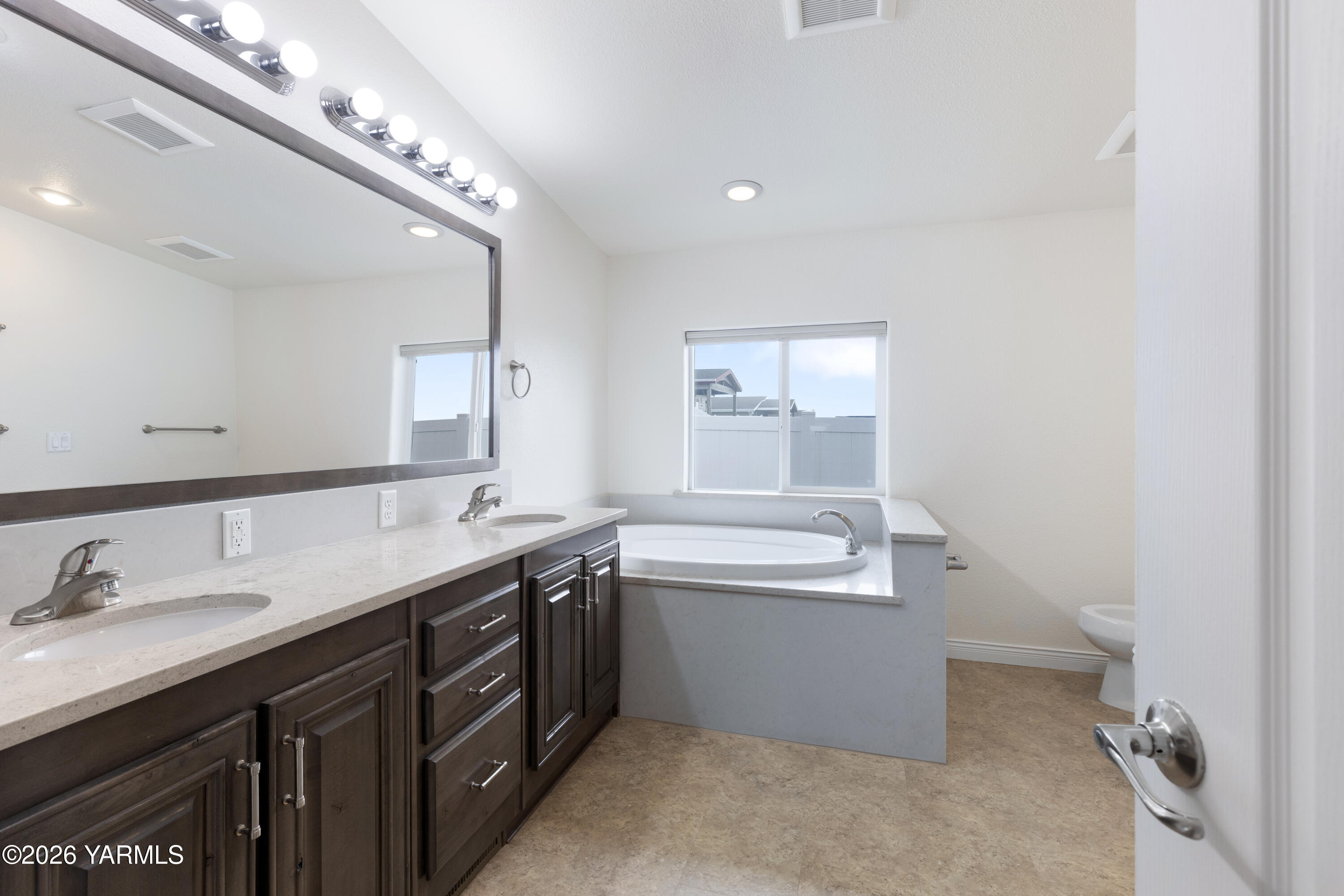200 Bridle Way, Unit 157 Yakima, WA 98901 - Photo 16 of 30 a bathroom with a sink double vanity and a mirror