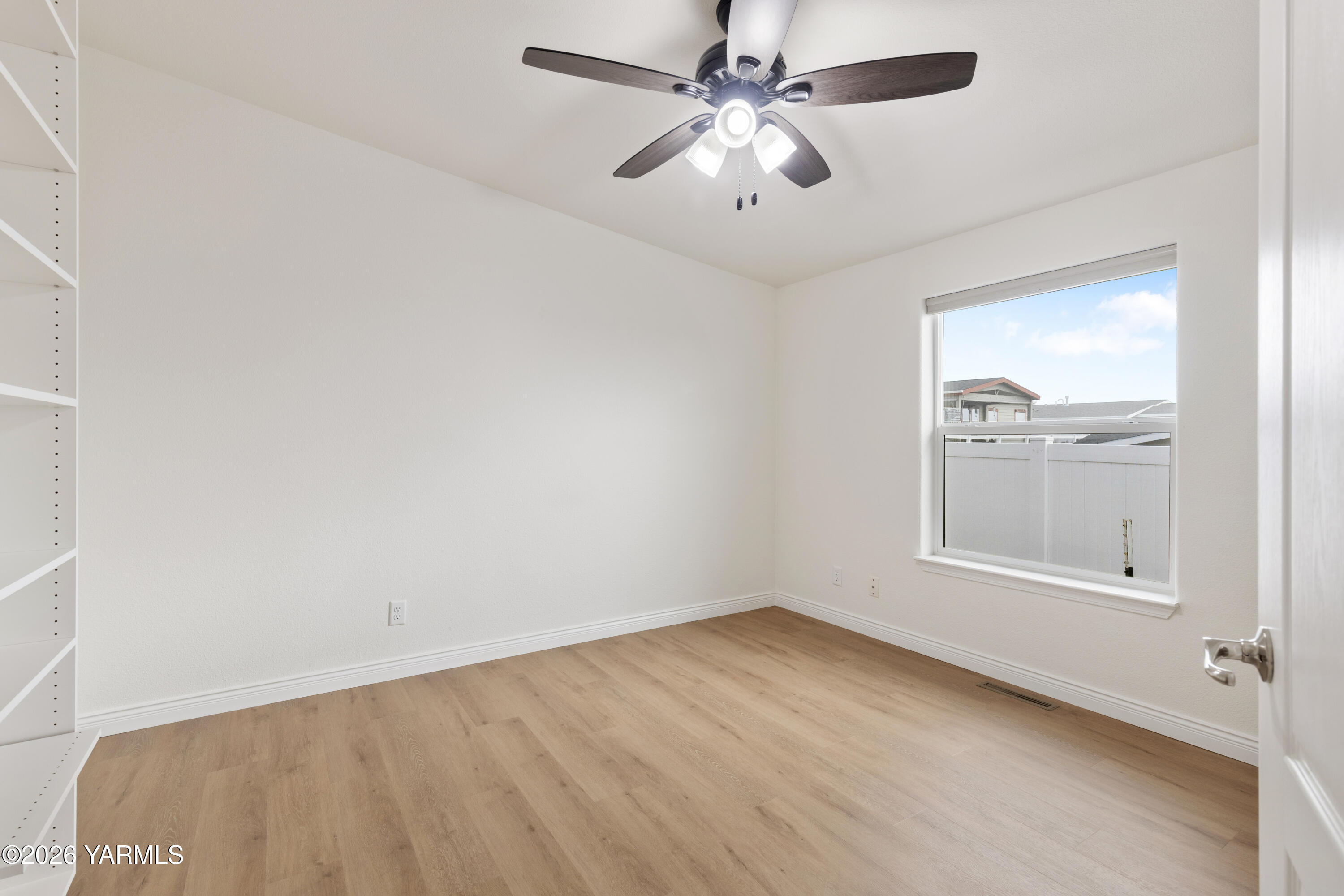 200 Bridle Way, Unit 157 Yakima, WA 98901 - Photo 19 of 30 an empty room with a window and a fan