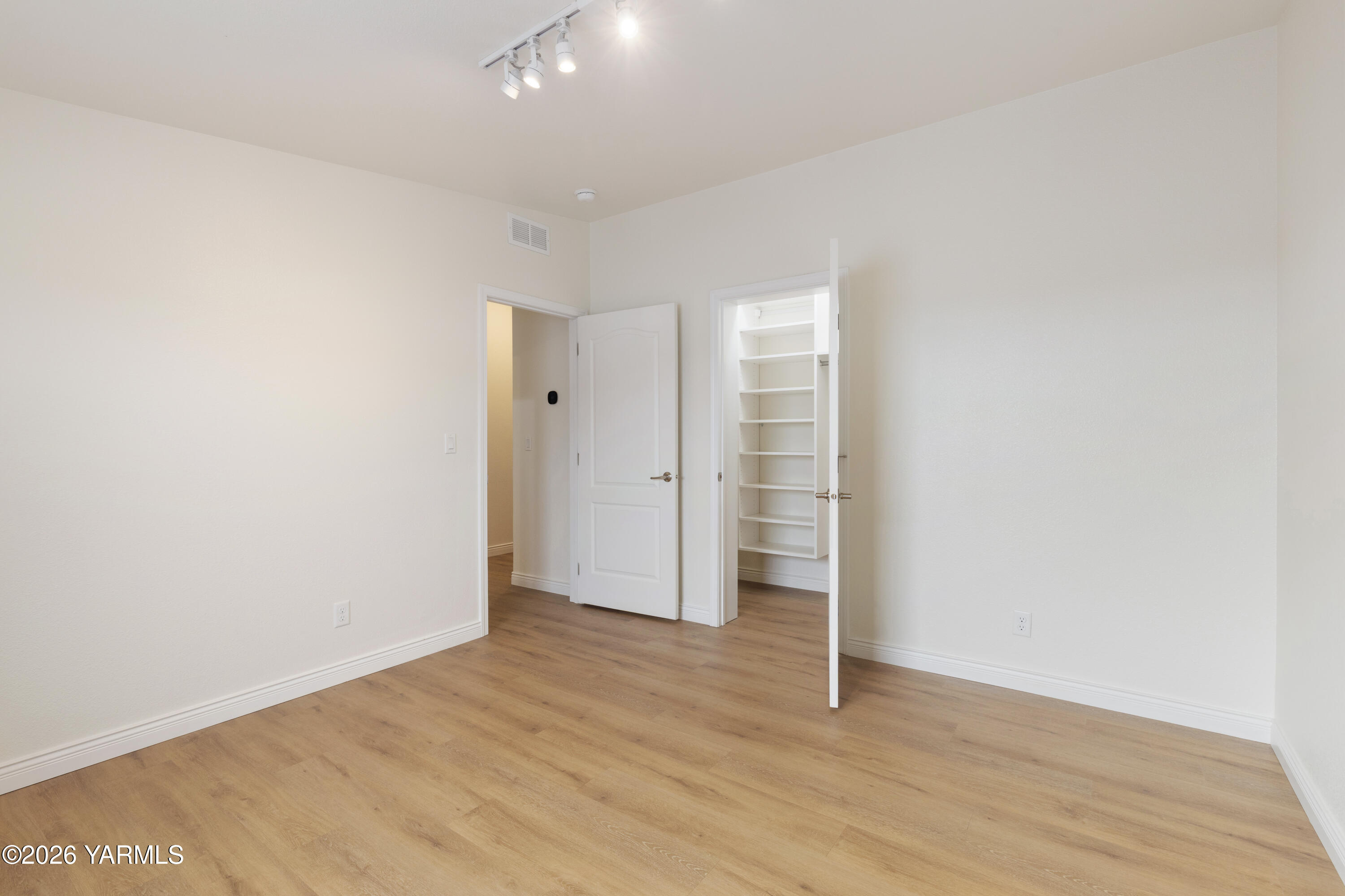200 Bridle Way, Unit 157 Yakima, WA 98901 - Photo 21 of 30 an empty room with wooden floor and closet