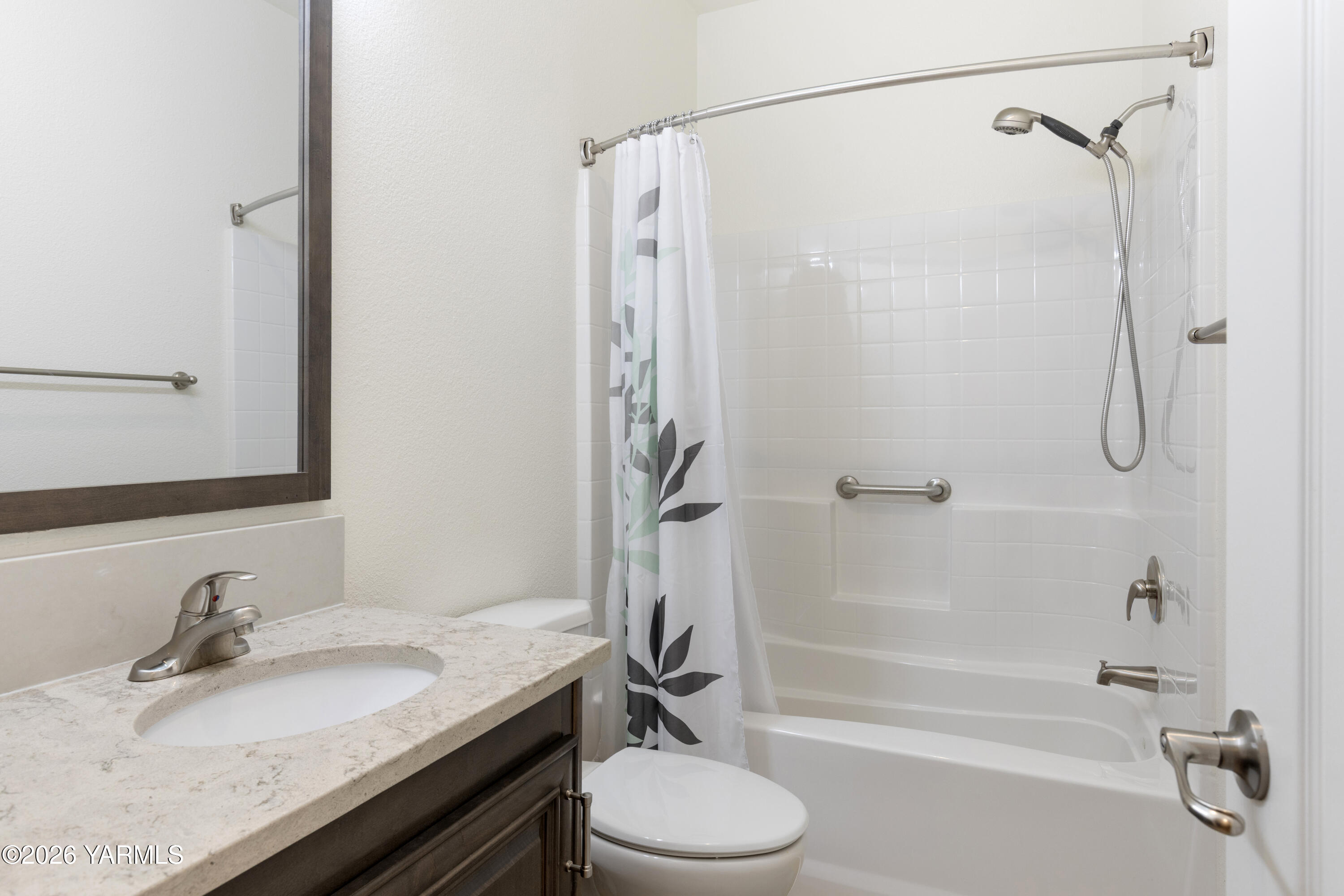 200 Bridle Way, Unit 157 Yakima, WA 98901 - Photo 23 of 30 a bathroom with a granite countertop sink toilet and shower