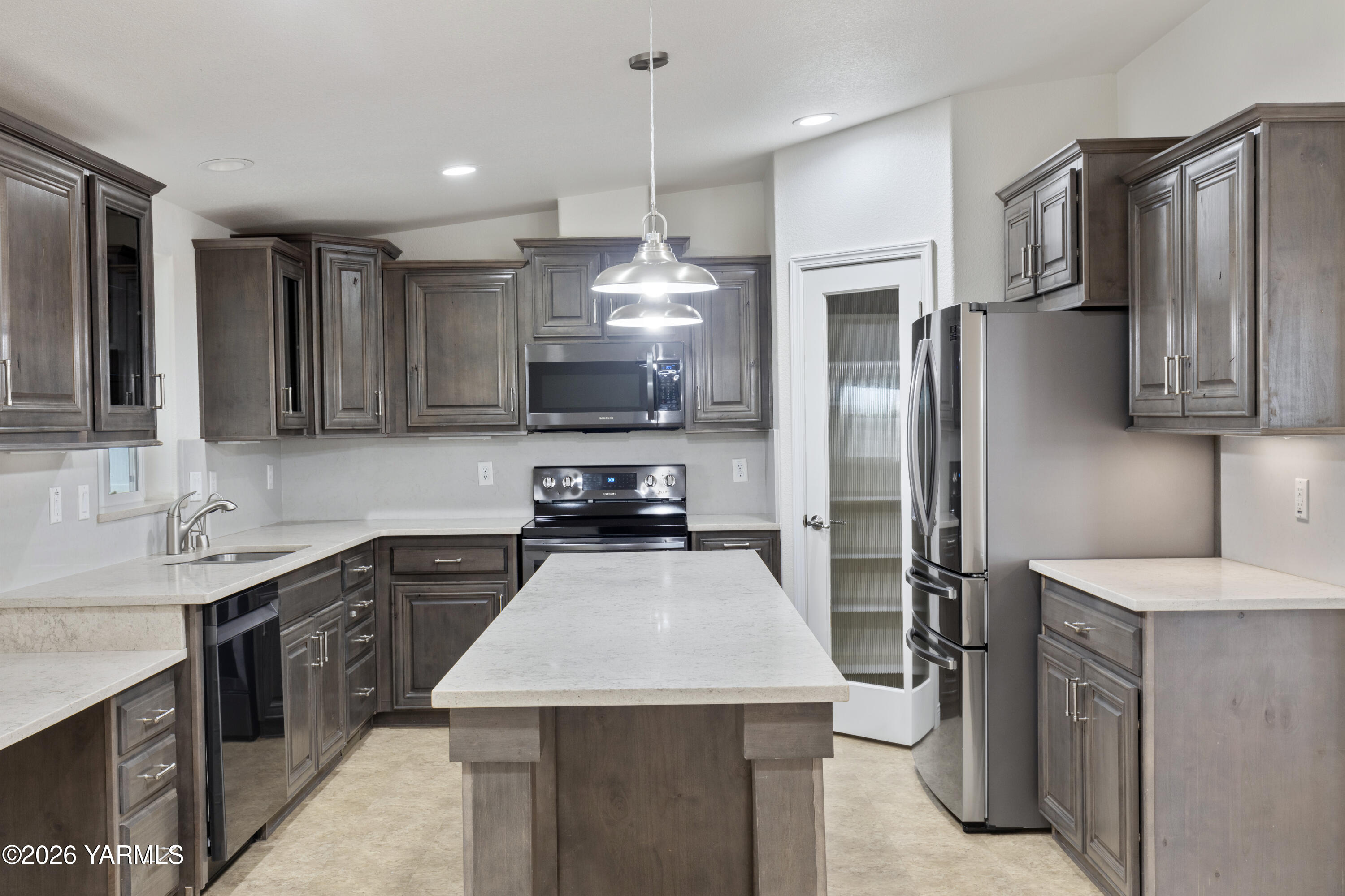 200 Bridle Way, Unit 157 Yakima, WA 98901 - Photo 10 of 30 a kitchen with stainless steel appliances a sink stove refrigerator and cabinets
