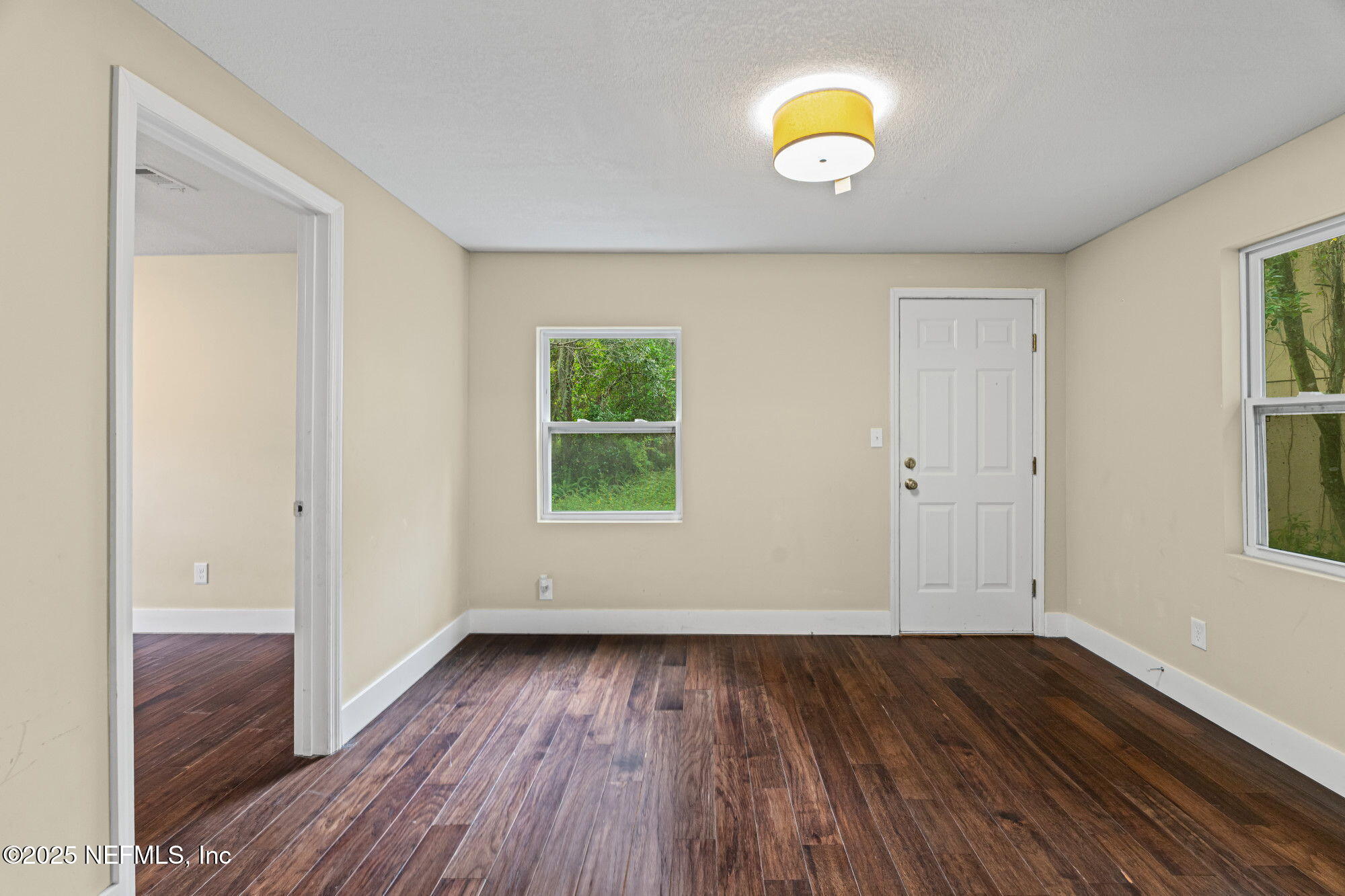 2310 Jerusalem Street Jacksonville, FL 32207 - Photo 15 of 39 an empty room with wooden floor and windows