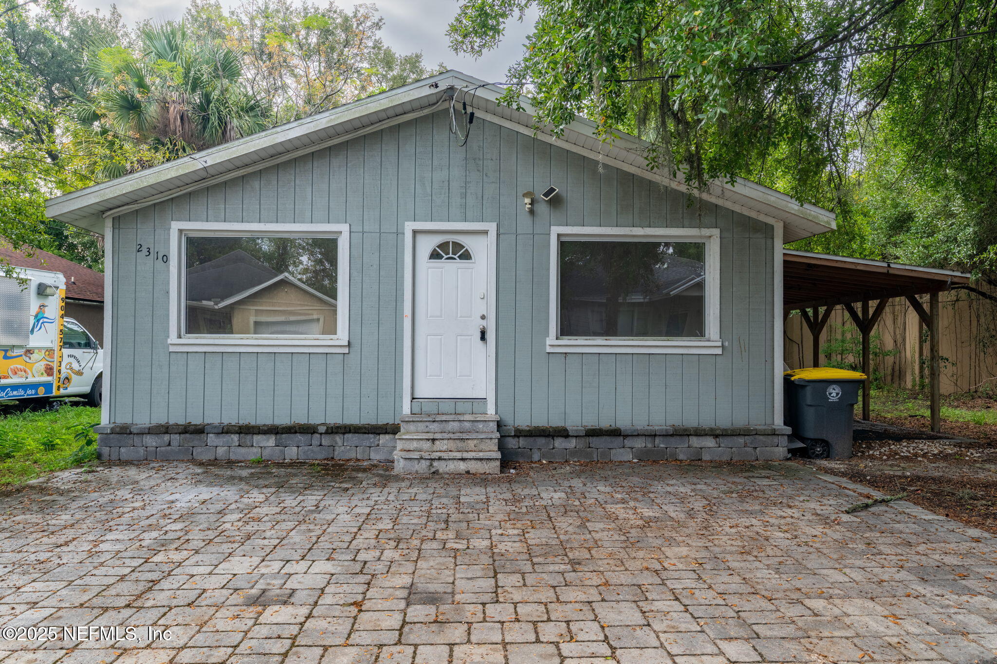 2310 Jerusalem Street Jacksonville, FL 32207 - Photo 2 of 39 a front view of a house with garden