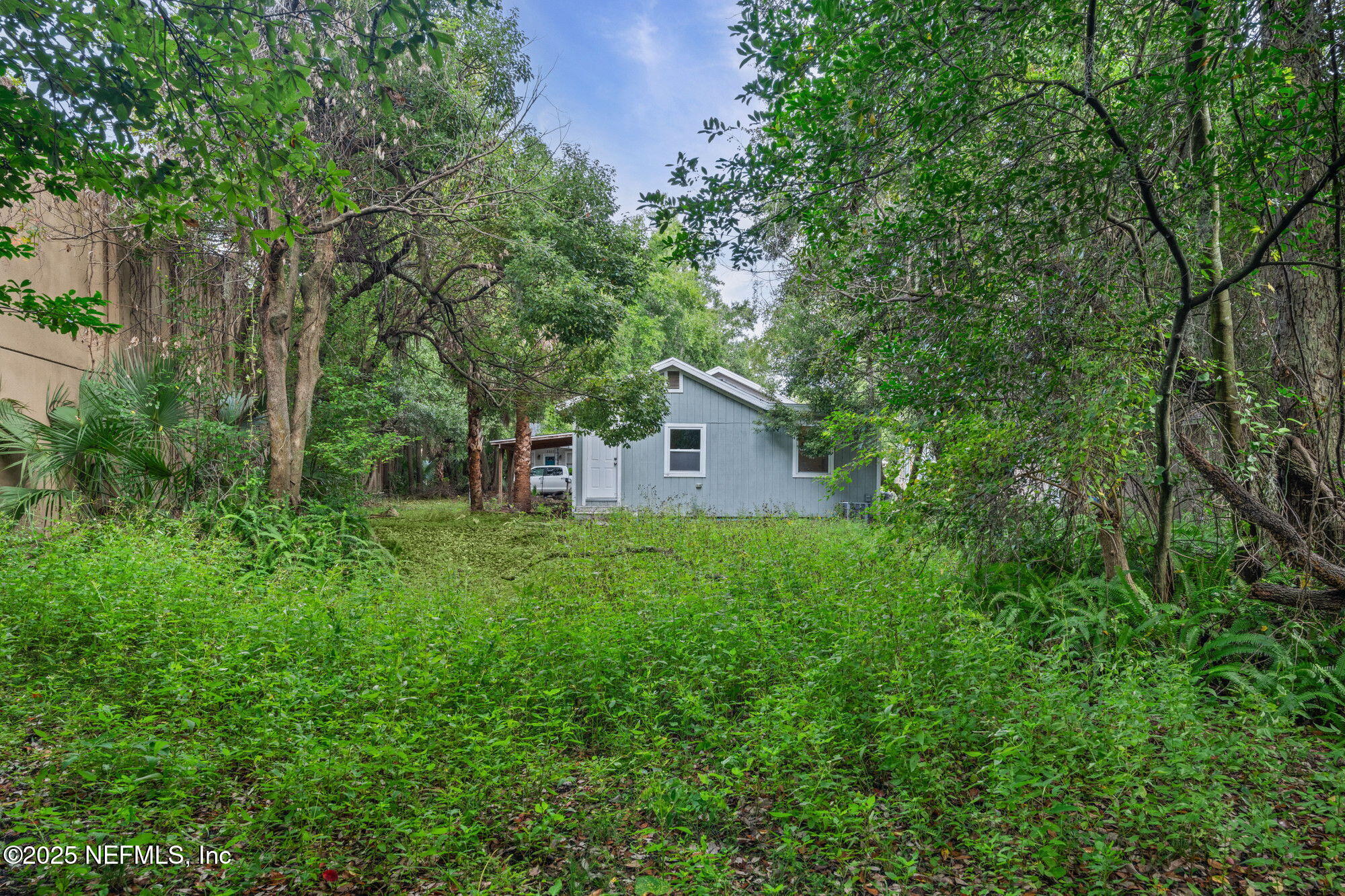 2310 Jerusalem Street Jacksonville, FL 32207 - Photo 33 of 39 a view of a house with backyard and garden