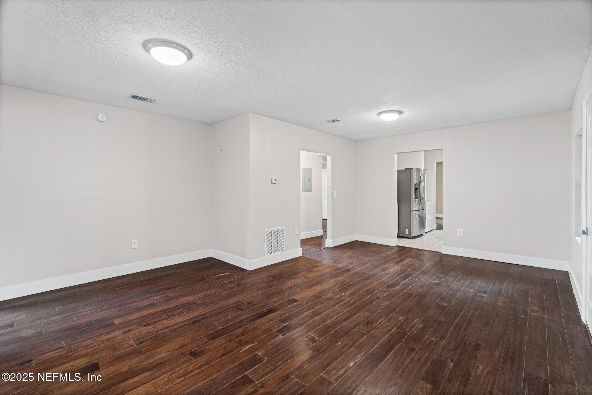 2310 Jerusalem Street Jacksonville, FL 32207 - Photo 8 of 39 a view of an empty room with wooden floor