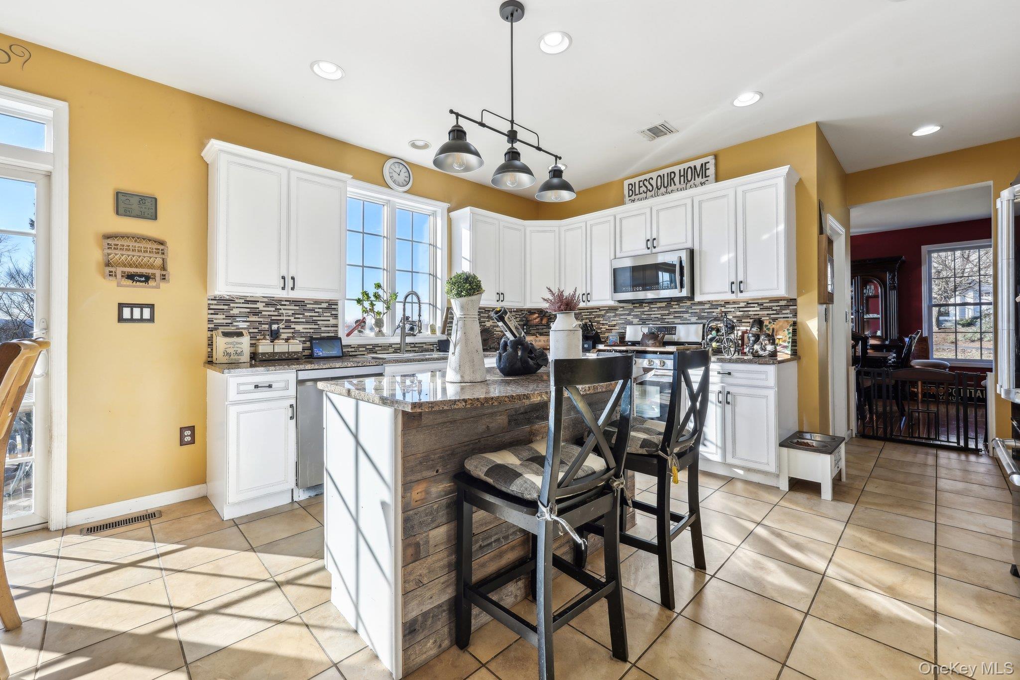 13 Mansion Ridge Boulevard Monroe, NY 10950 - Photo 12 of 49 a view of a dining room with furniture