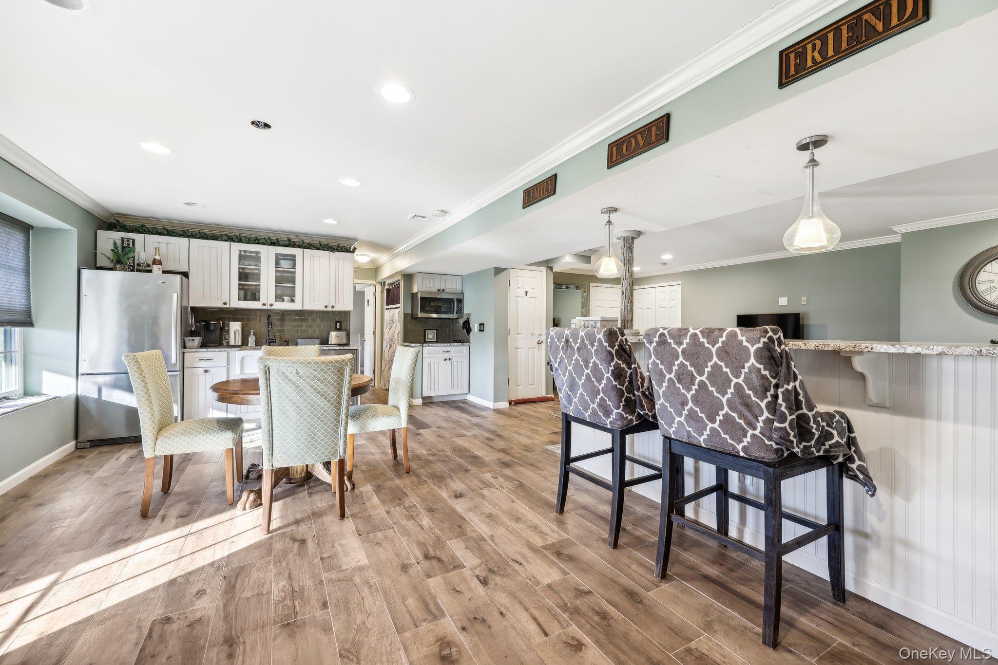 13 Mansion Ridge Boulevard Monroe, NY 10950 - Photo 33 of 49 a view of a dining room with furniture and wooden floor