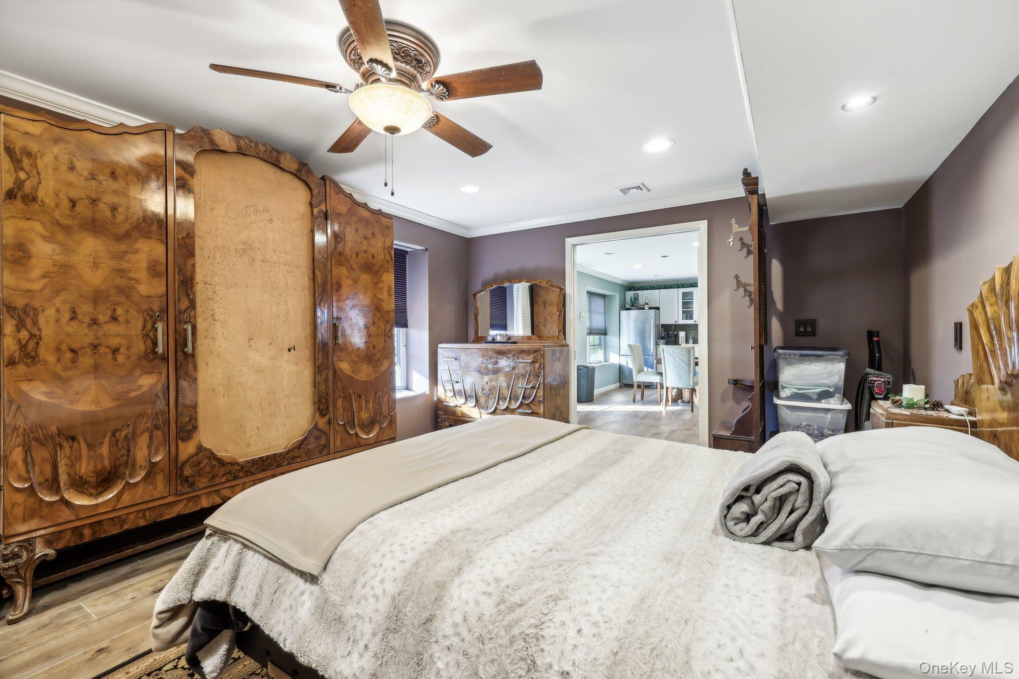 13 Mansion Ridge Boulevard Monroe, NY 10950 - Photo 36 of 49 a bedroom with a bed and a chandelier