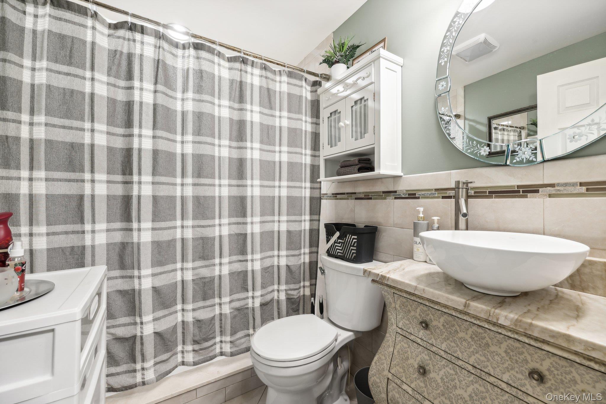 13 Mansion Ridge Boulevard Monroe, NY 10950 - Photo 37 of 49 a bathroom with a granite countertop toilet a sink and a mirror