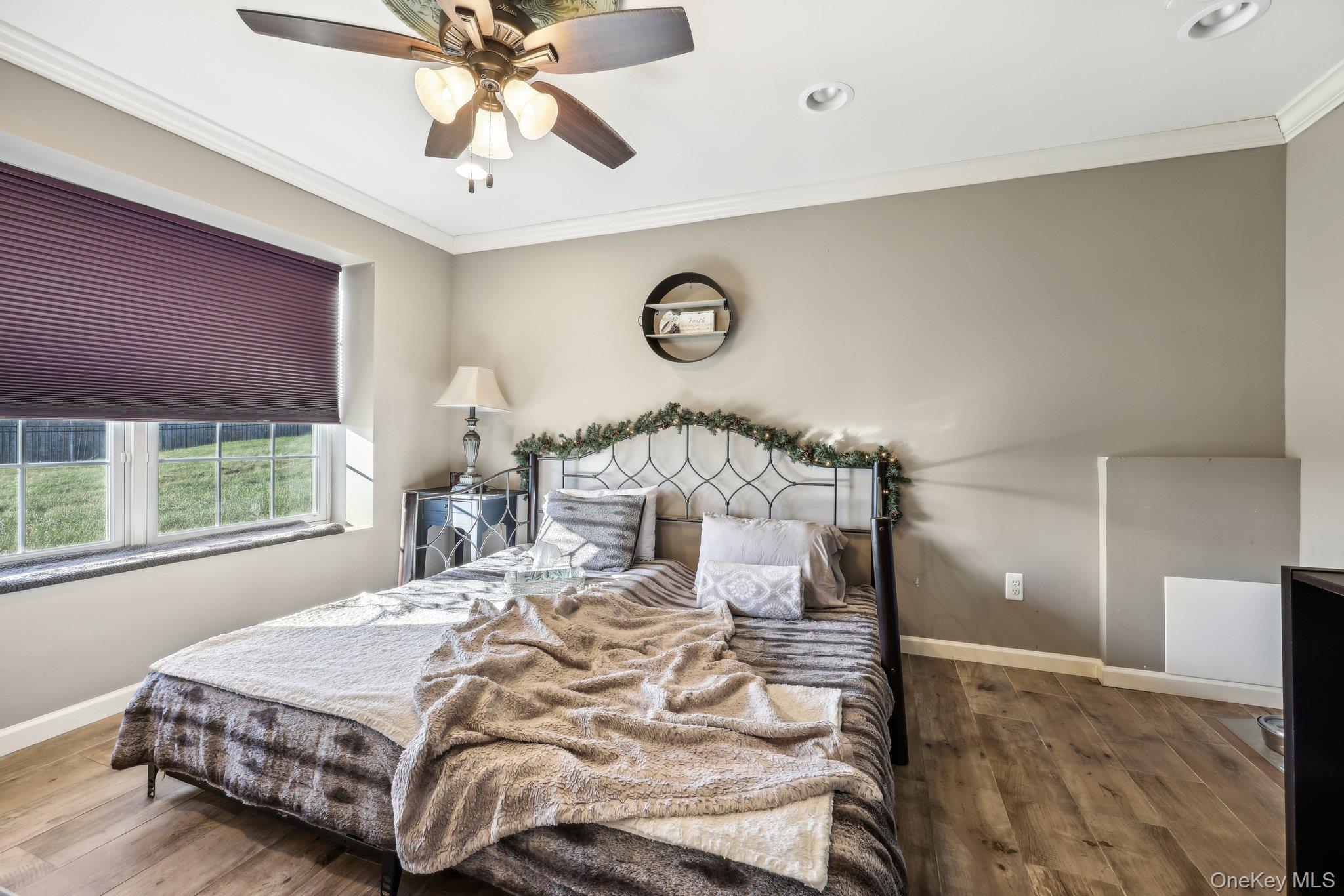 13 Mansion Ridge Boulevard Monroe, NY 10950 - Photo 38 of 49 a bedroom with a bed and window with lamp