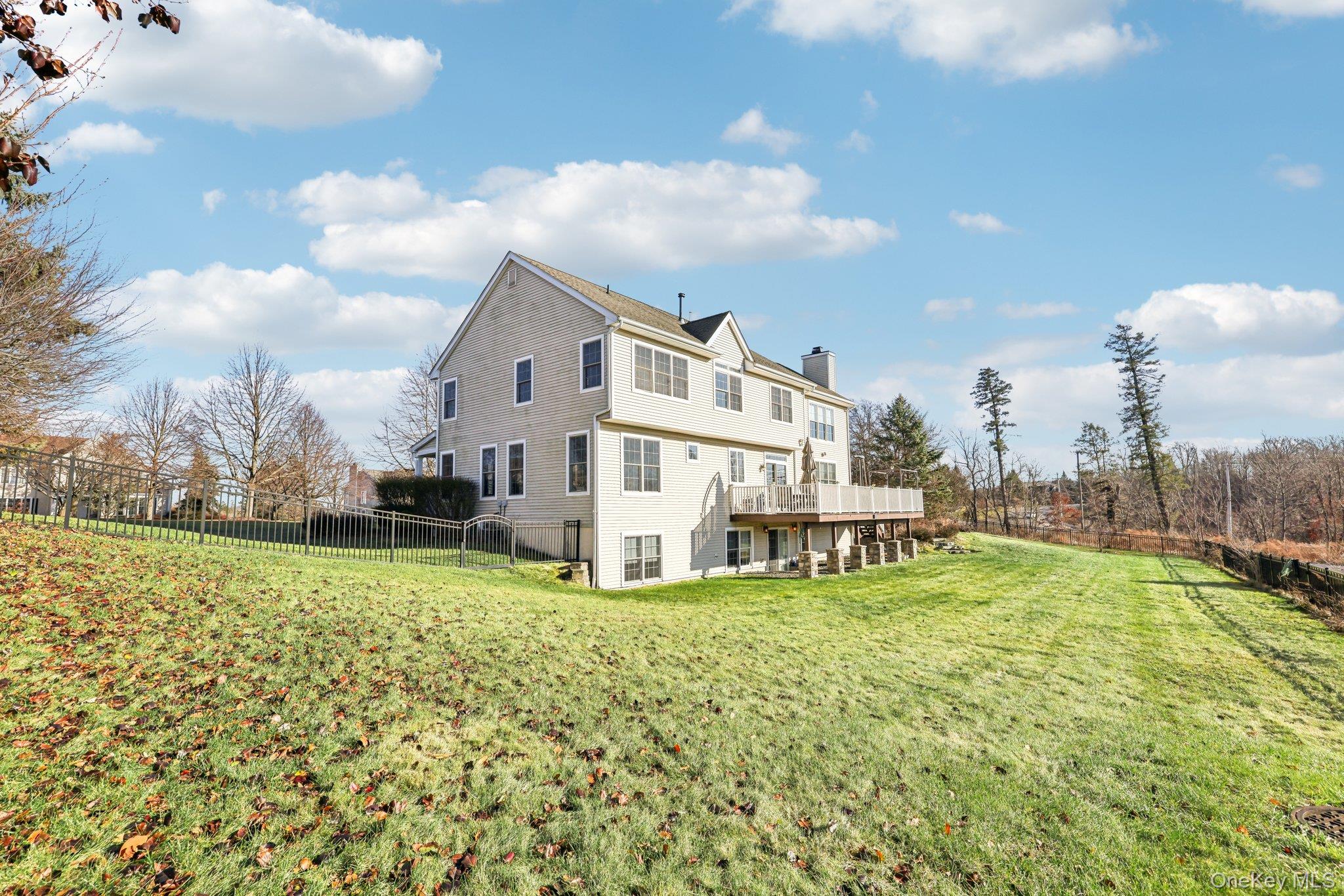 13 Mansion Ridge Boulevard Monroe, NY 10950 - Photo 44 of 49 a view of a house with a big yard and large trees