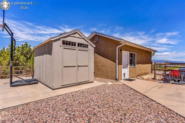 182 Raptor Court Canon City, CO 81212 - Photo 37 of 50 The property also includes a detached storage shed located just behind the 1 car detached garage that offers added space for tools, lawn equipment, or seasonal items.
