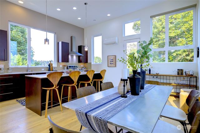 a view of a dining room with furniture window and wooden floor