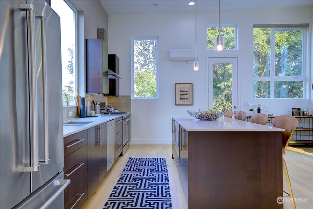 a kitchen with sink cabinets and window