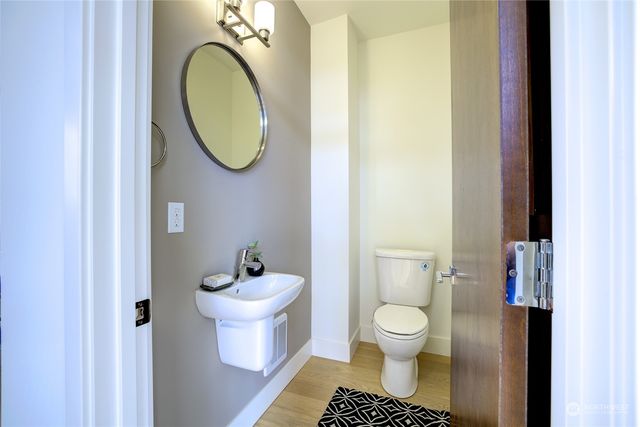 a bedroom with a bed and windows