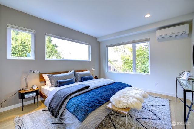 a bedroom with a bed and a lamp