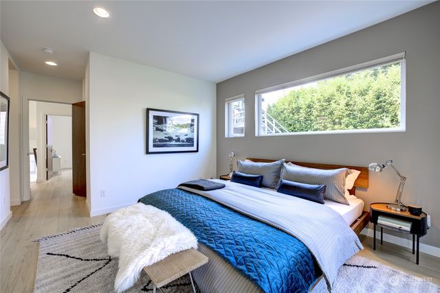 a bedroom with a bed and a dresser