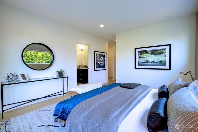 a white toilet sitting next to a bathroom sink