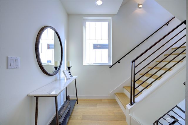 a view of entryway with a window and a mirror