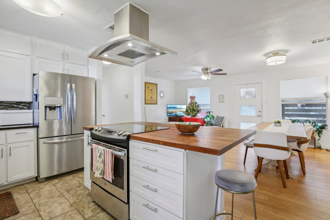 4413 Russell Drive Austin, TX 78704 - Photo 12 of 29 a kitchen with cabinets and stainless steel appliances