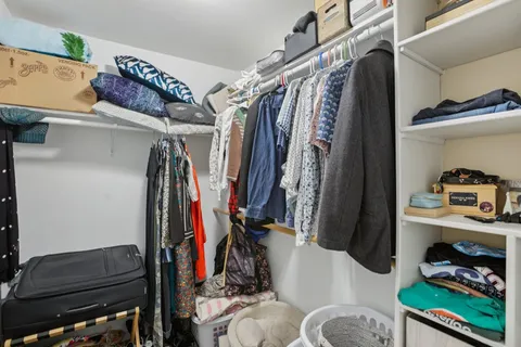 a bathroom with a sink a mirror and a shower