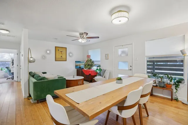 a kitchen that has a table and chairs in it