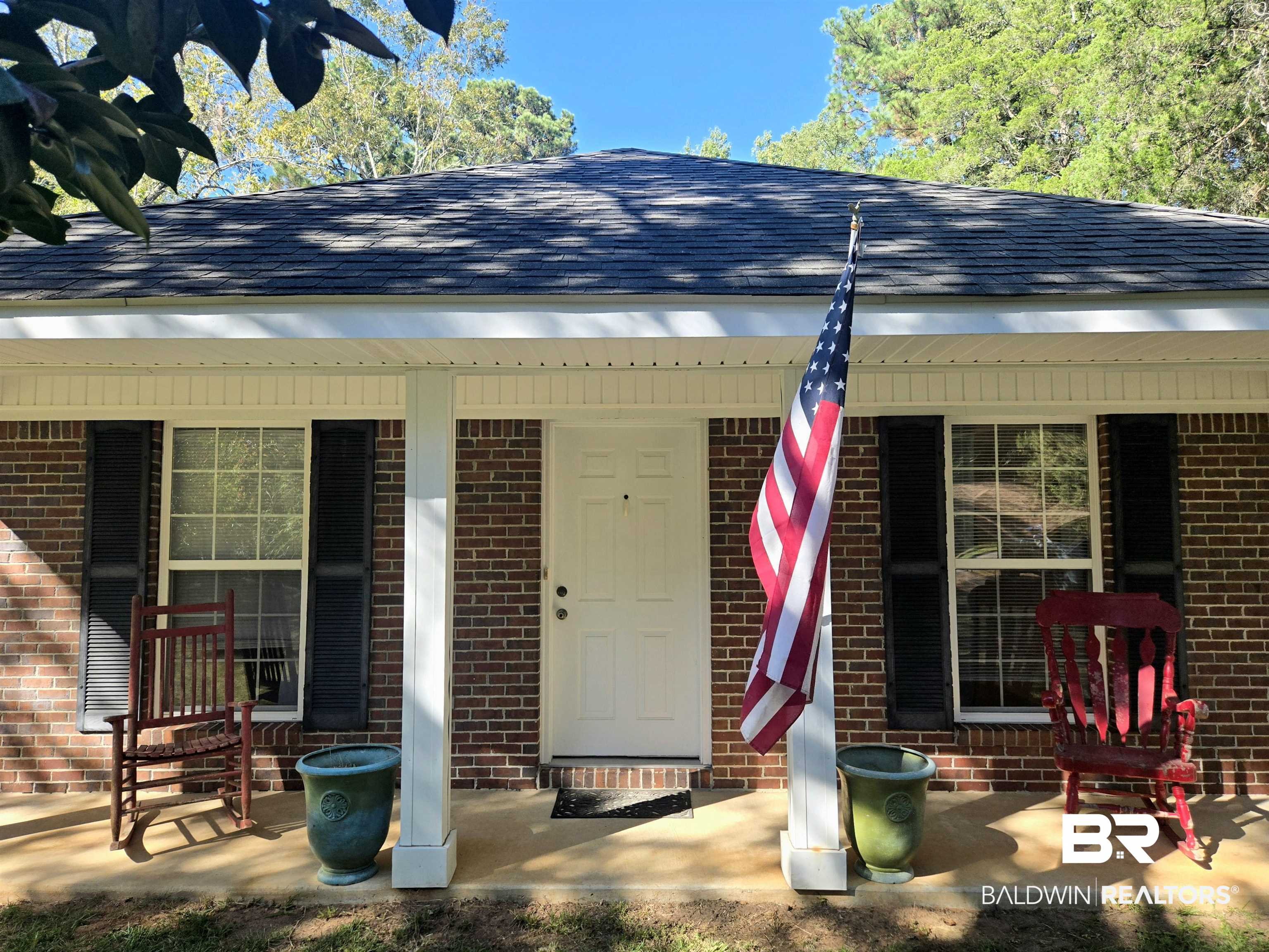 2554 Riverside Drive Mobile, AL 36605 - Photo 2 of 43 Entrance to property with roof with shingles, covered porch, and brick siding