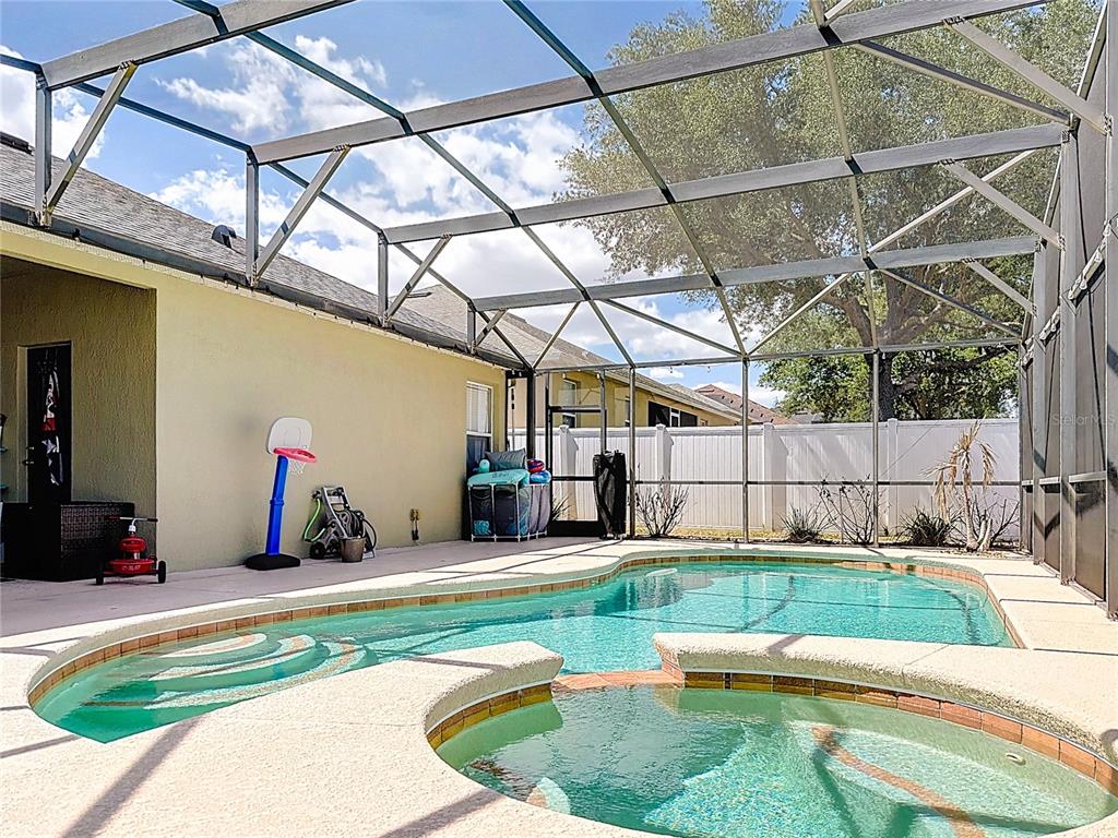 135 Blackstone Creek Road Groveland, FL 34736 - Photo 4 of 62 a view of a backyard with swimming pool