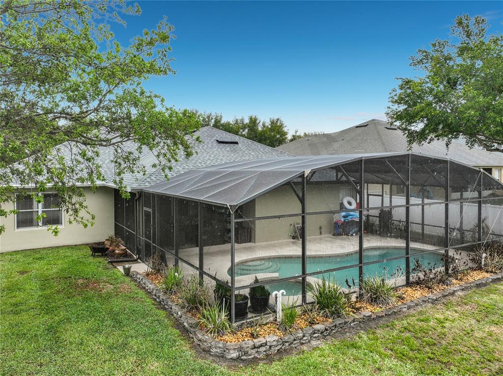 135 Blackstone Creek Road Groveland, FL 34736 - Photo 52 of 62 a view of backyard with green space