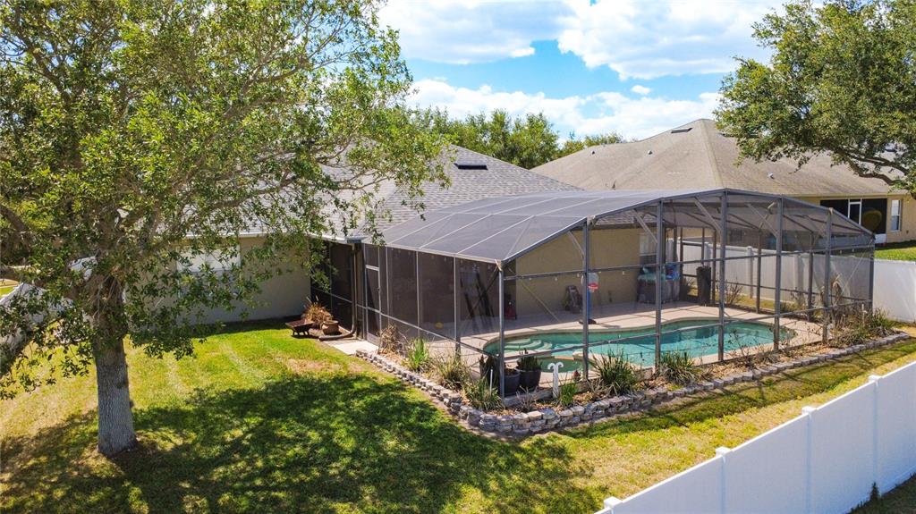 135 Blackstone Creek Road Groveland, FL 34736 - Photo 57 of 62 a view of a house with a yard balcony and sitting area