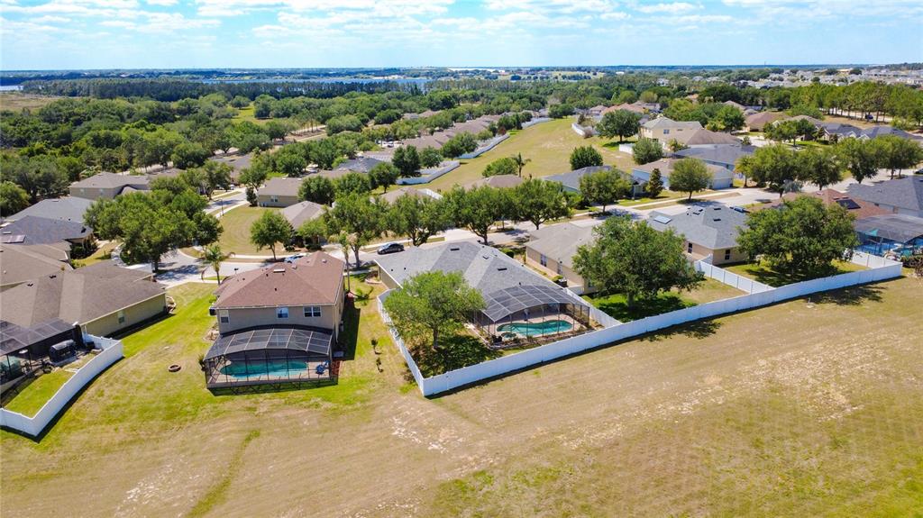 135 Blackstone Creek Road Groveland, FL 34736 - Photo 58 of 62 an aerial view of residential houses with outdoor space and street view
